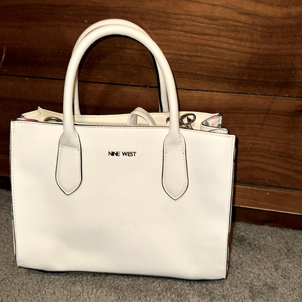 White purse with flower accents